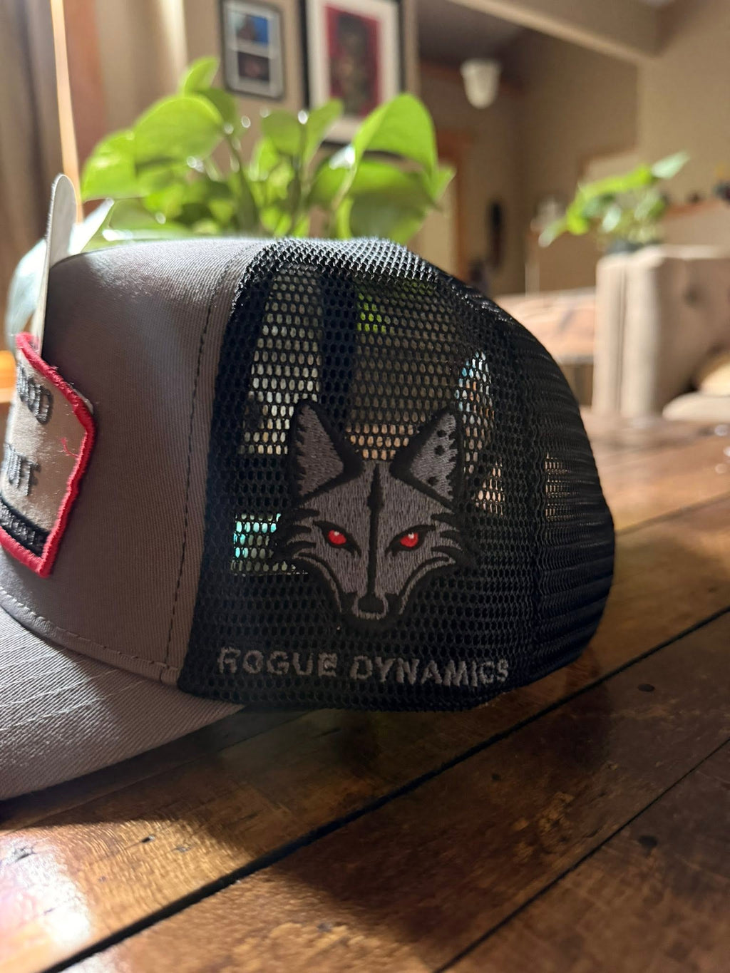 Rogue Dynamics fox embroidered on the black mesh side panel of the Shady Stuff trucker hat