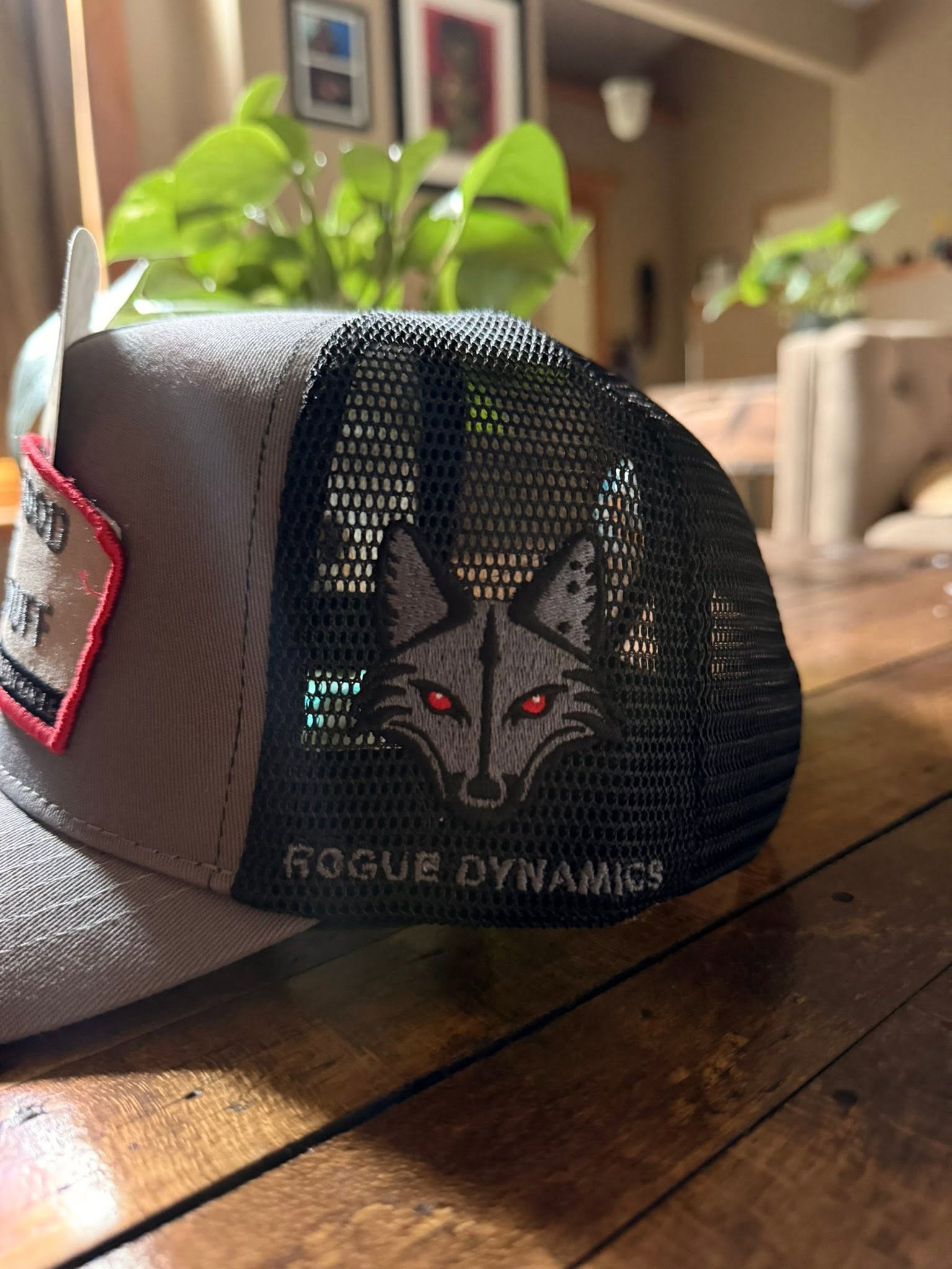 Rogue Dynamics fox embroidered on the black mesh side panel of the Shady Stuff trucker hat