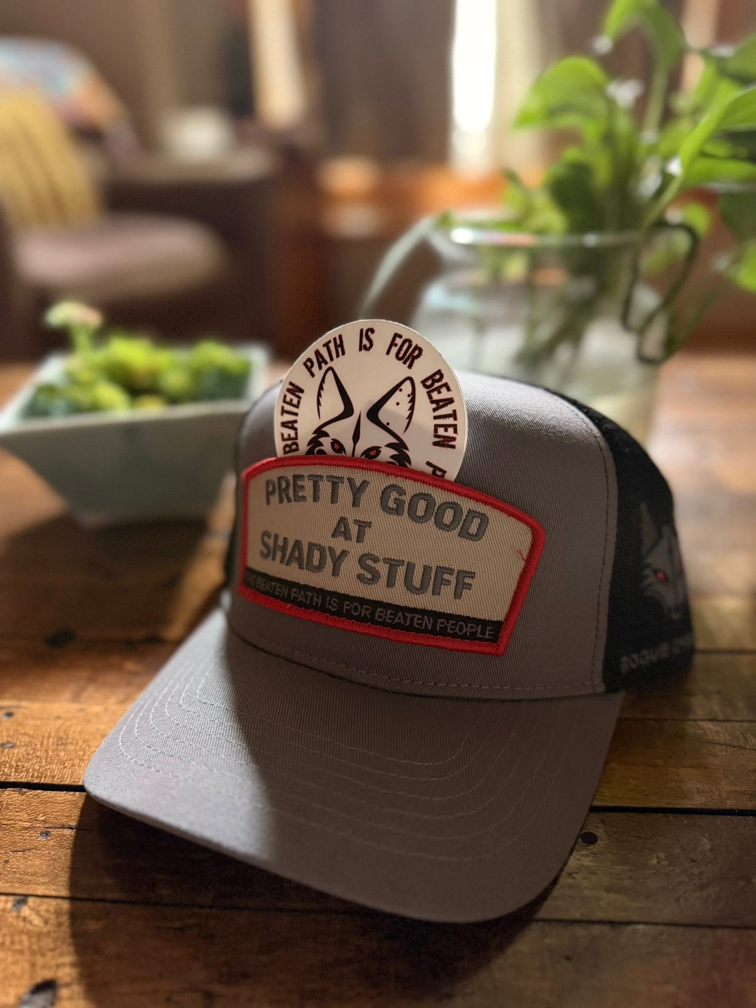 Shady Stuff hat with the Rogue Dynamics beaten-path two-fox sticker tucked behind the patch